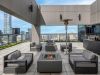 Optima Signature in Downtown Chicago with Modern rooftop patio with gray seating, fire pits, city skyline views, and outdoor kitchen—perfect for morning rituals in inviting spaces.