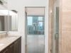 Optima Signature in Downtown Chicago with Modern bathroom design with marble counter, glass shower, and bright room featuring city views—perfect for inspired bathroom decor.
