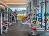 Optima Signature in Downtown Chicago with Modern gym with exercise machines, free weights, and people working out—ideal for anyone pursuing an effortless wellness routine.