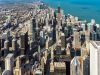 Optima Signature in Downtown Chicago with Aerial view of downtown Chicago with tall skyscrapers, Lake Michigan, and vibrant urban lifestyle in the background.
