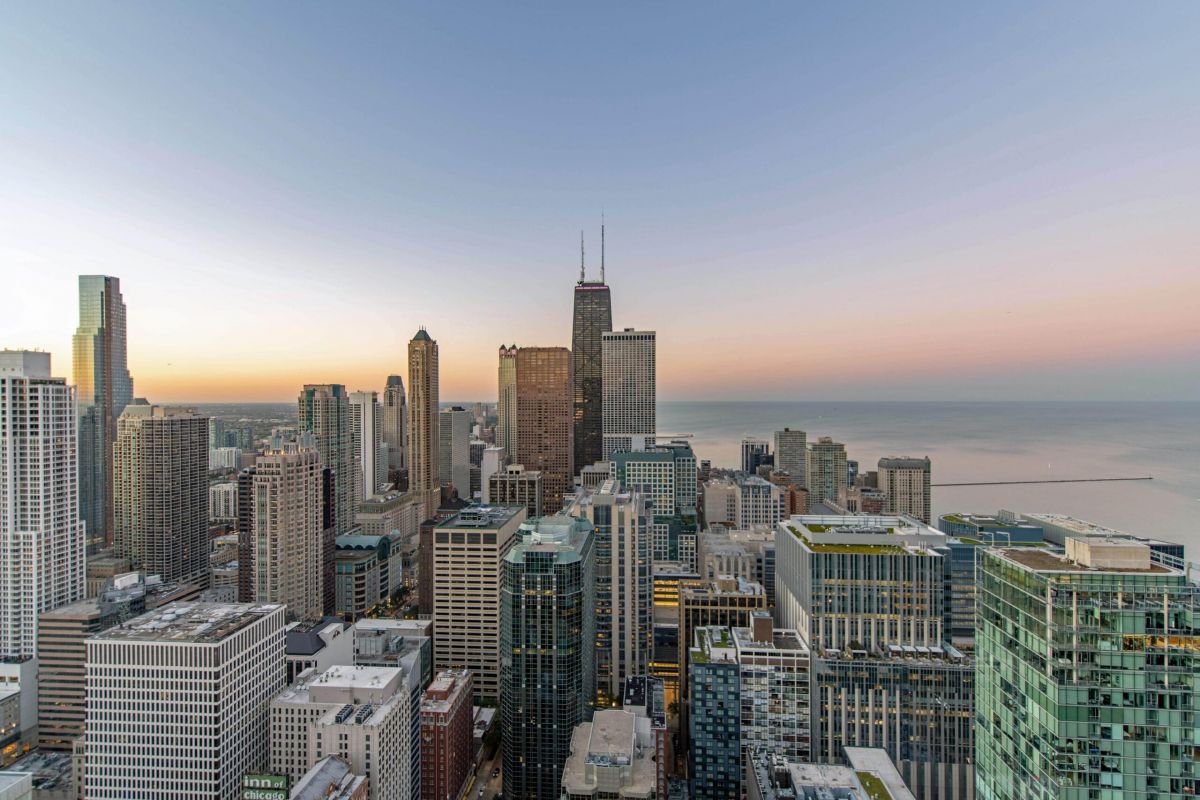Panoramic sunset view of the Chicago skyline and Lake Michigan from Optima Signature in the Streeterville neighborhood