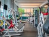 Optima Signature in Downtown Chicago with Modern fitness center with various weight machines, benches, and free weights in a bright, spacious room with large windows—ideal for your daily habit.