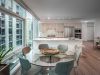 Optima Signature in Downtown Chicago with Modern Optima apartment kitchen design and dining area with large windows, glass table, and city views for a stylish home.
